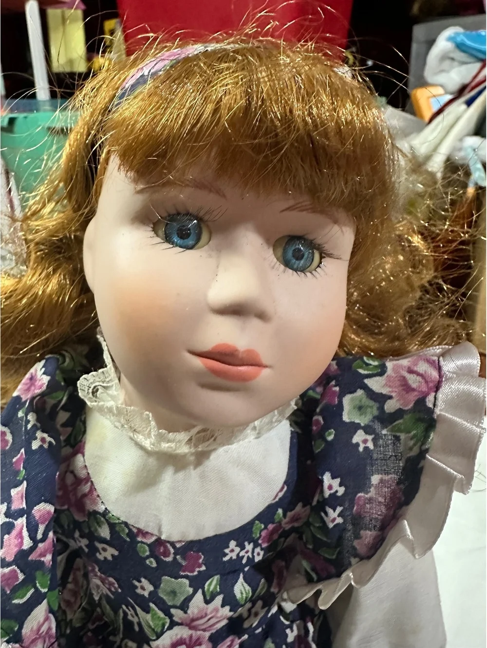 Vintage Porcelain Doll with Floral Dress and Curly Red Hair